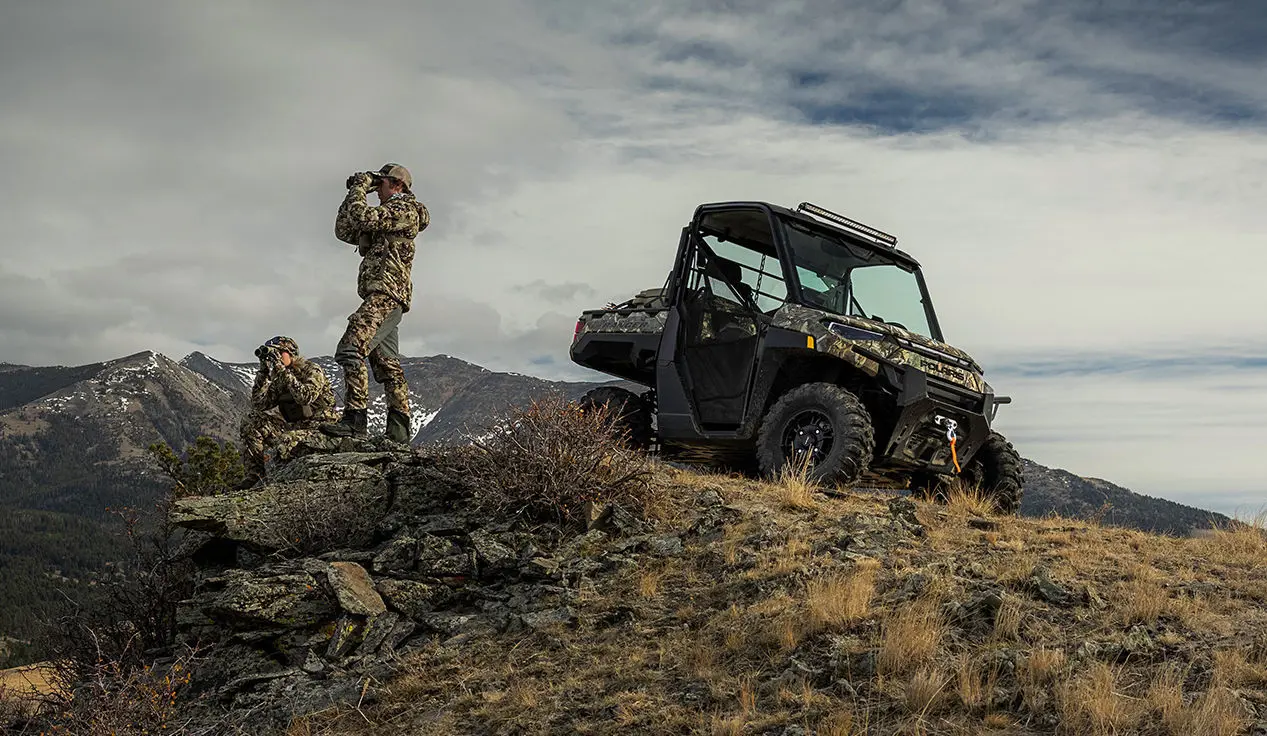 hunters scoping out the land near their polaris ranger xp kinetic electric UTV