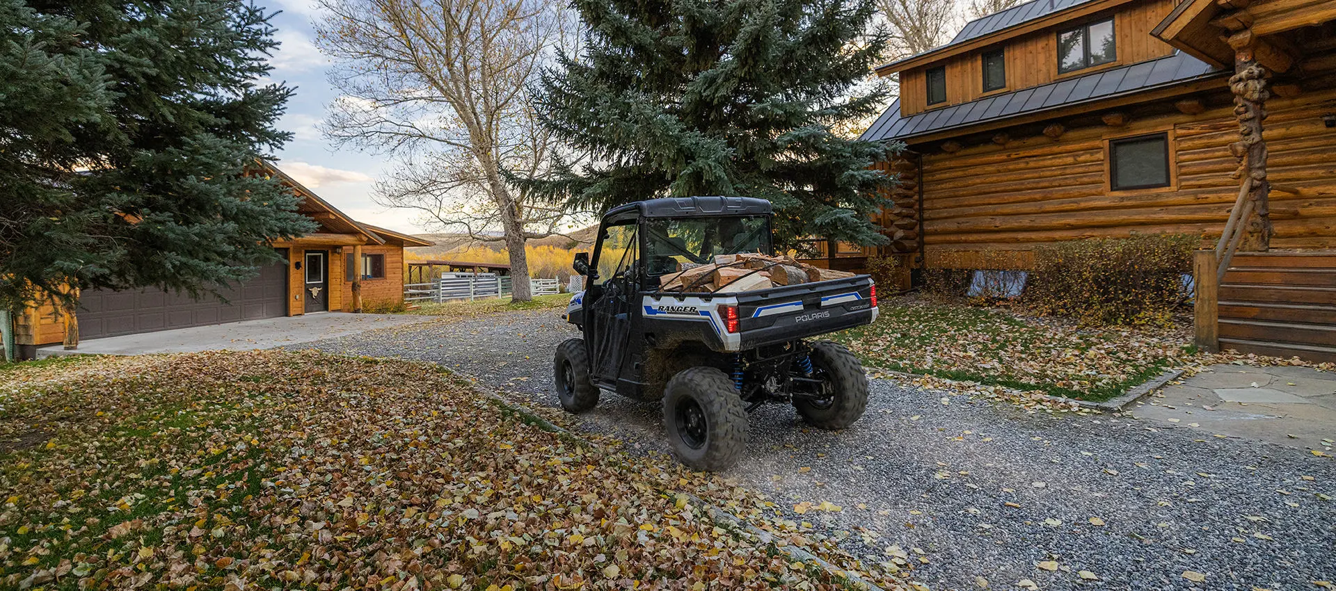 polaris ranger xp kinetic electric UTV hauling wood in the cargo box