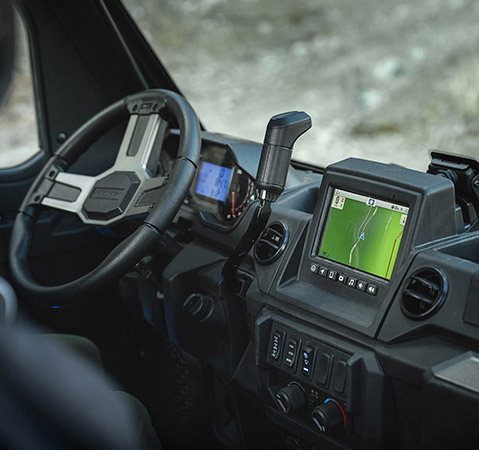 Interior of a PolarisRANGER UTV showing the RIDE COMMAND display with a detailed trail map.