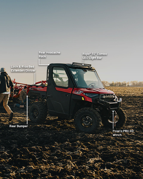 Rear bumper, Lock & Ride bed extender, rear headache rack, RIGID 32-inch combo led light bar, and Polaris Pro HD Winch accessories from the Farm/Ranch package installed on a 2025 Polaris RANGER XP 1000 NorthStar Edition UTV. 