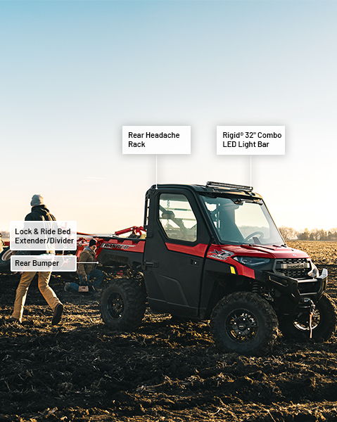 Rear headache rack, RIGID 32-inch combo LED light bar, Lock & Ride bed extender/divider and rear bumper accessories from the Farm/Ranch Package installed on a 2025 Polaris RANGER XP 1000 NorthStar Edition UTV.