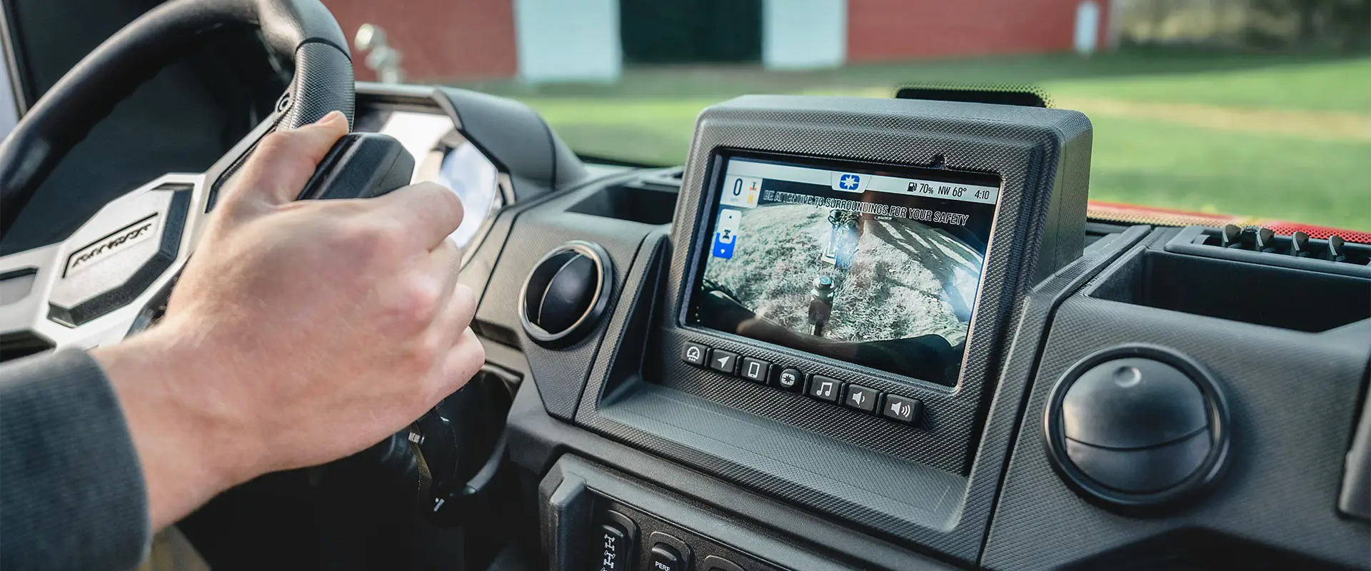 Closeup of the RIDE COMMAND touch screen in the all-season enclosed cab of a 2026 Polaris RANGER XP 1000 NorthStar Edition utility vehicle.