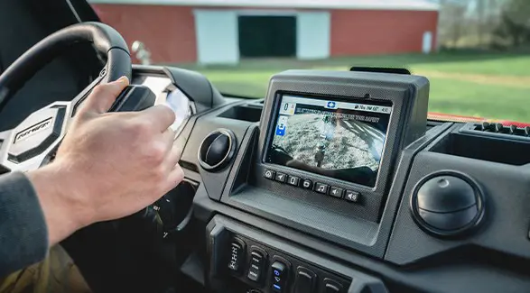 Closeup of the RIDE COMMAND touch screen in the all-season enclosed cab of a 2026 Polaris RANGER XP 1000 NorthStar Edition utility vehicle.