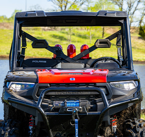 Front-end view showcasing the headlights on a 2027 Polaris RANGER XP 1000 Mud Edition UTV.