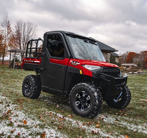 A rider enjoying the factory-installed heat in a 2027 Polaris RANGER XP 1000 NorthStar enclosed UTV.