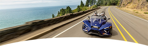A Polaris Slingshot on the road