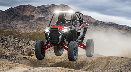 RZR airborne leaping on a trail