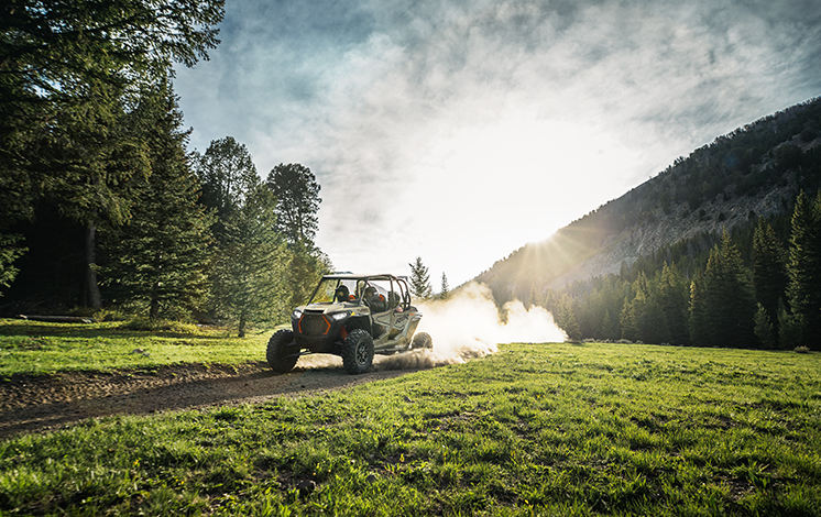 RZR XP 4 Turbo on a green field