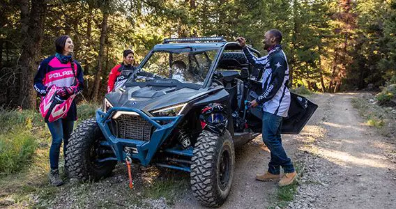rzr riders relaxing after a forest trail ride