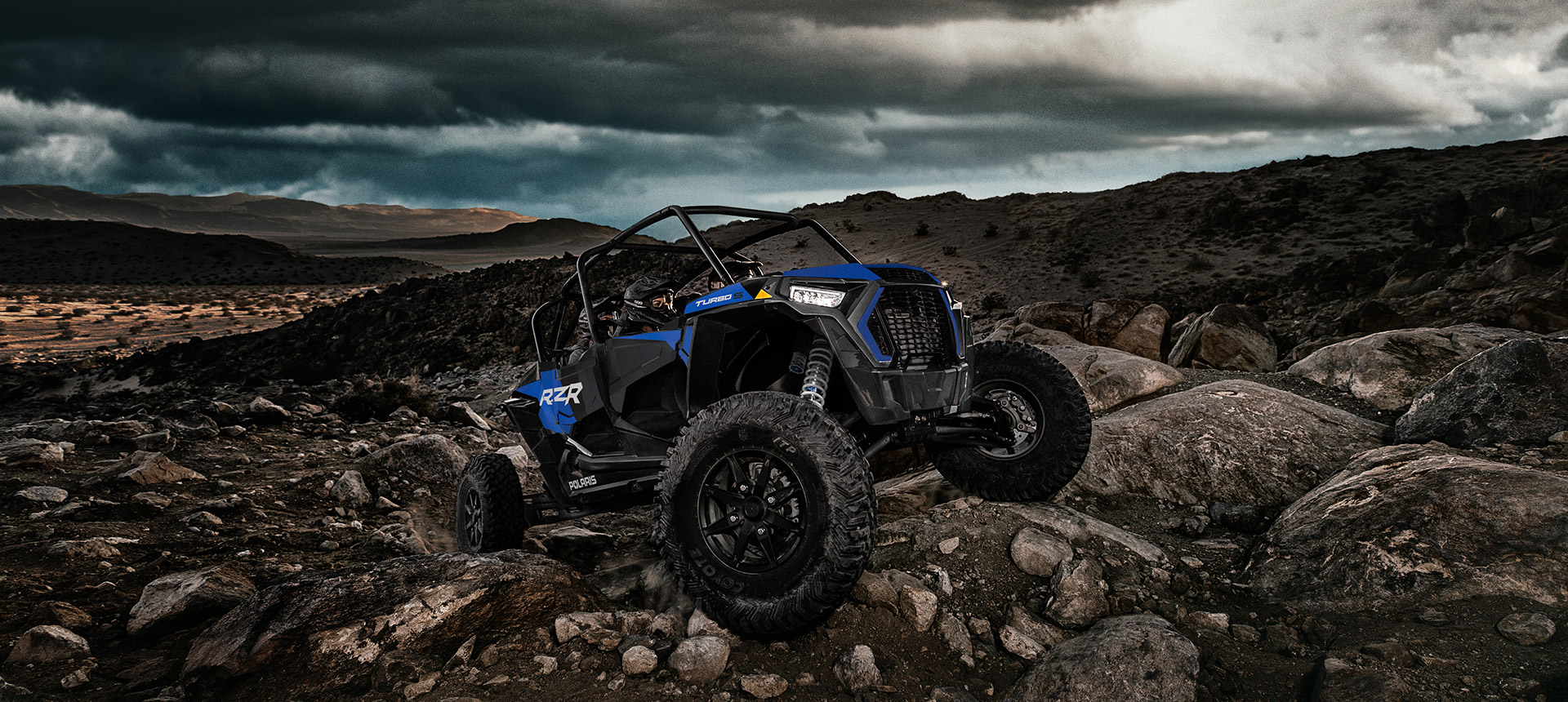 RZR Turbo S Velocity climbing a rocky hill