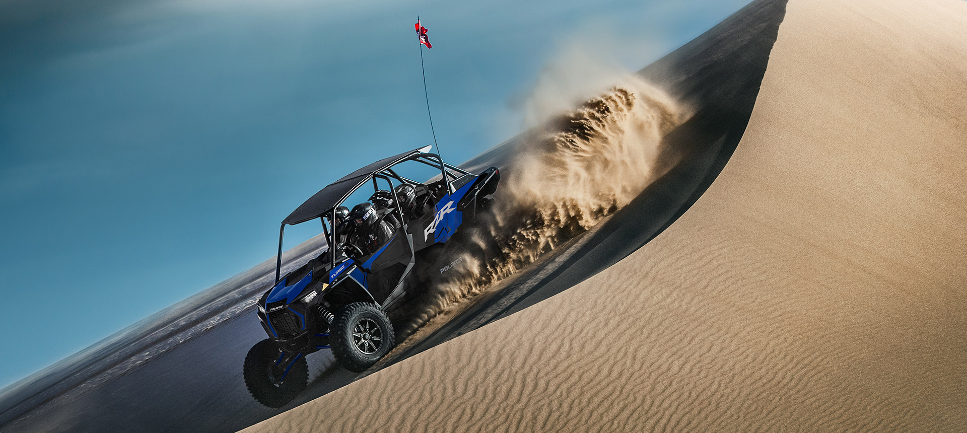A RZR Turbo S Velocity 4 on a dune