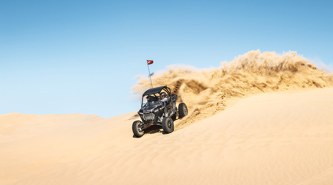 RZR Turbo S racing in the desert
