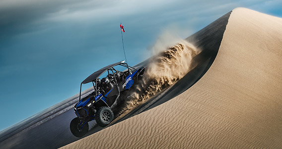A RZR Turbo S Velocity 4 on a dune