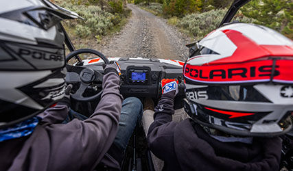 2 riders in a RZR 200 with youth ride control