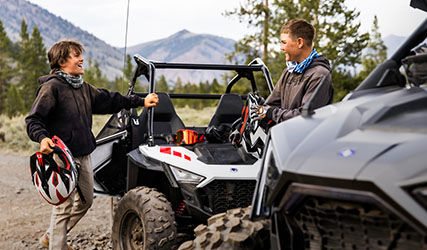 The RZR 200 features hard doors to keep riders safe
