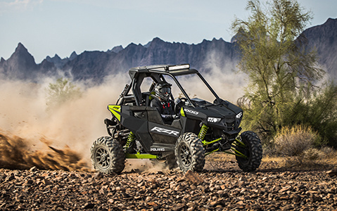 RZR RS1 rolling in a rocky trail