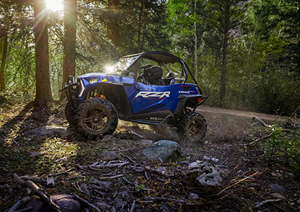 Polaris RZR Trail S cruising down a trail with accessories from the trailblazer collection installed