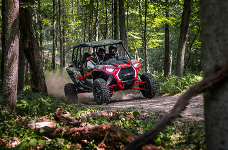 polaris xp 4 1000 with ride command cruising through the forest