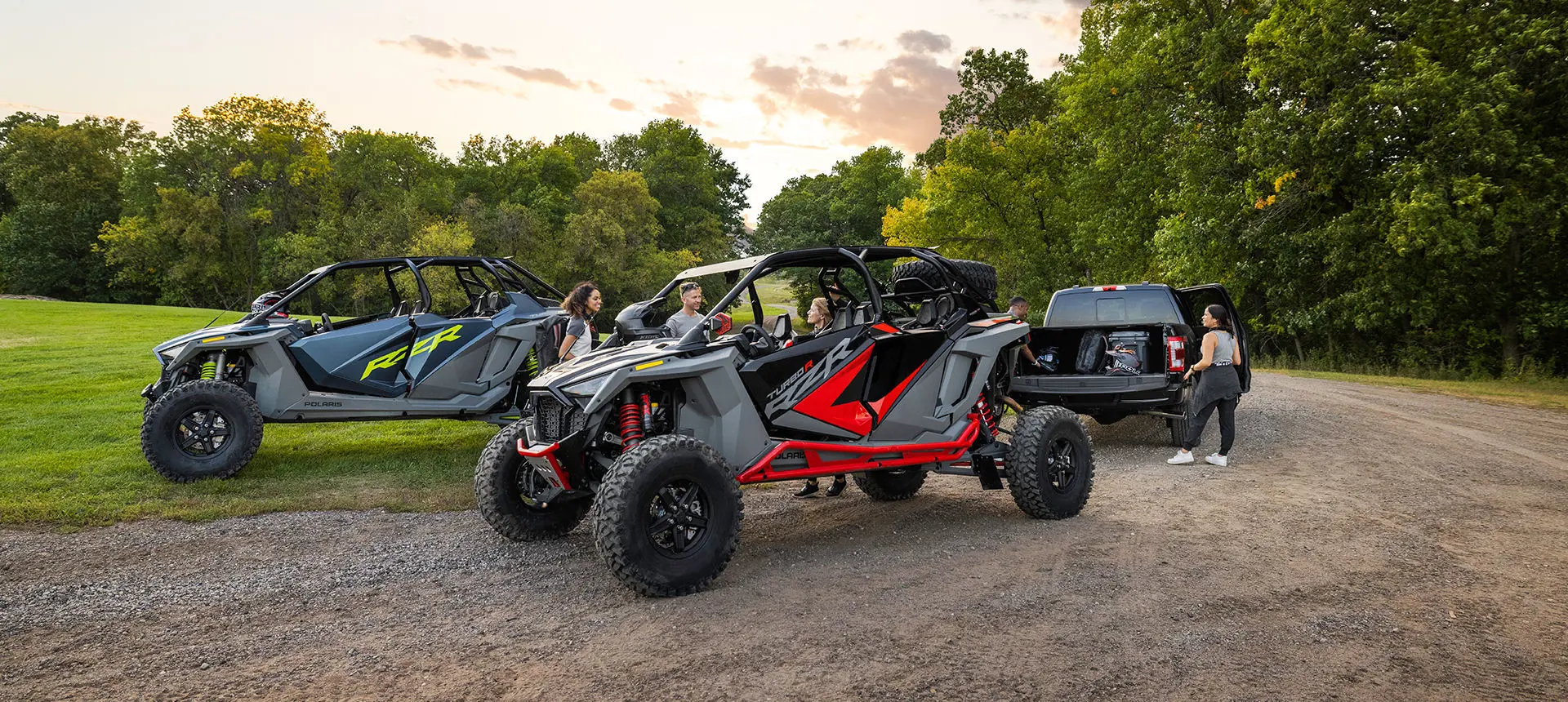 people preparing for a ride in their polaris rzr turbo r 4 side by sides