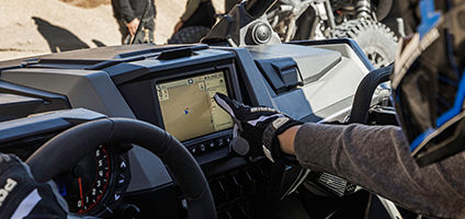 rider clutching the wheel in the precisely tuned polaris rzr turbo r