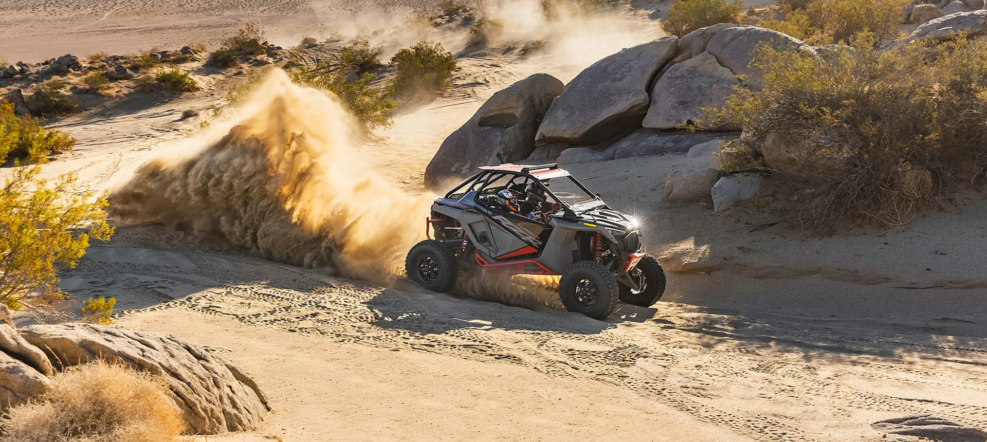 polaris rzr turbo r throwing dirt in the desert
