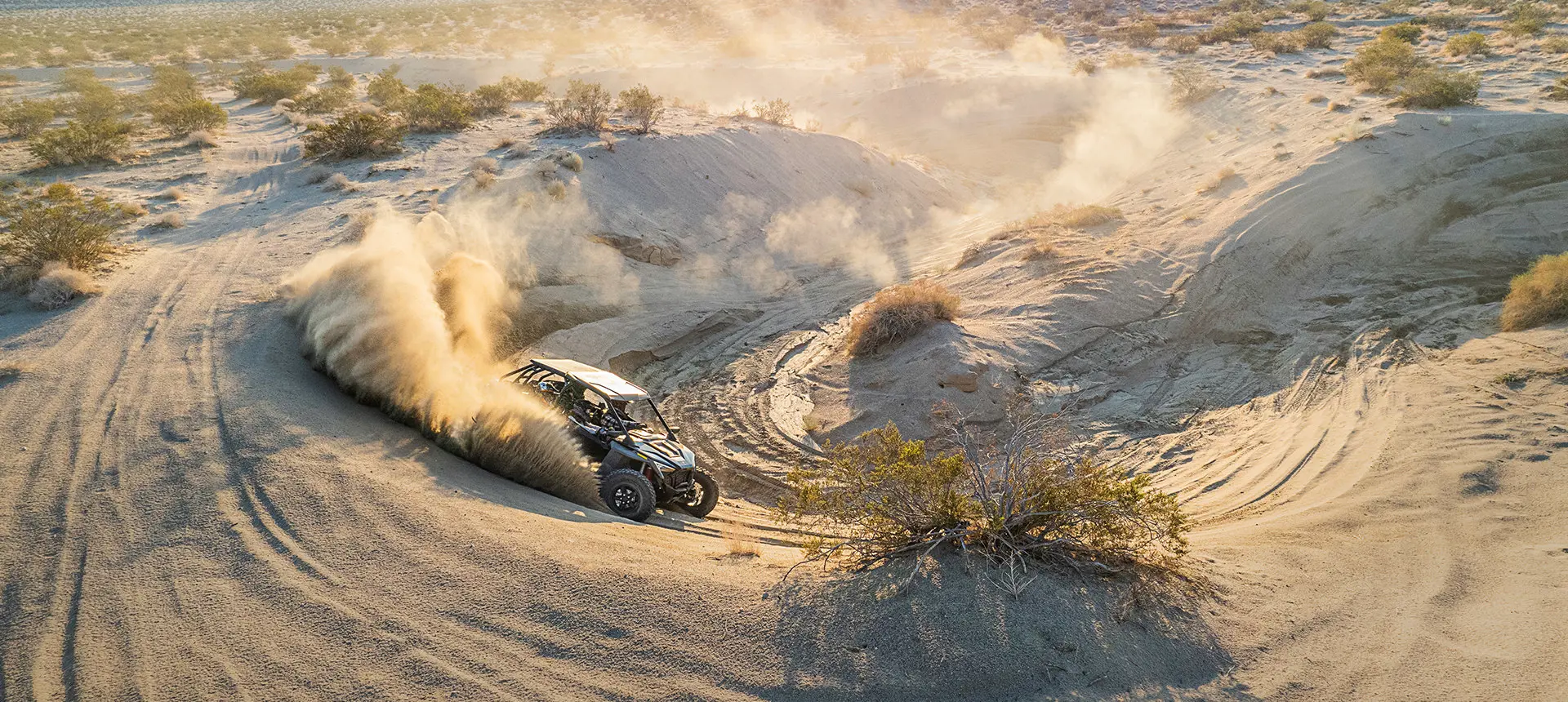 polaris rzr turbo r throwing sand in the dunes