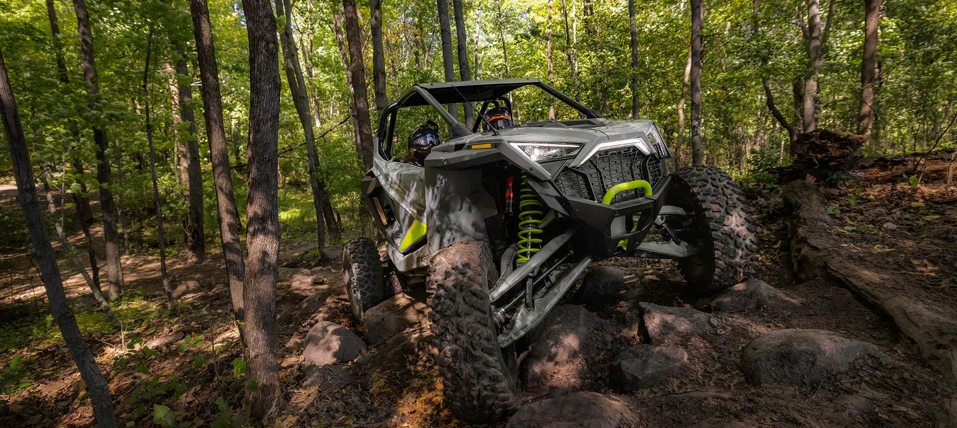 rzr turbo r climbing over rocky terrain with ease
