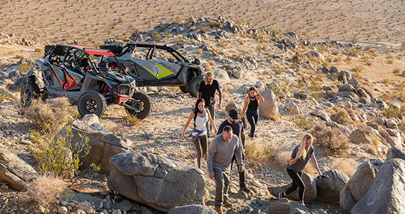 rzr riders climbing rocks after a ride