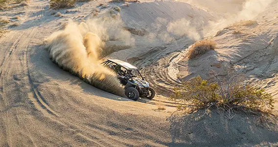 polaris rzr turbo r throwing sand in the dunes