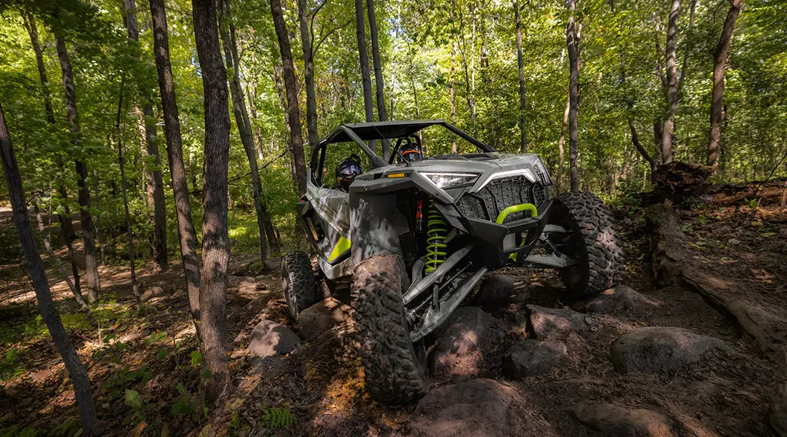 rzr turbo r climbing over rocky terrain with ease