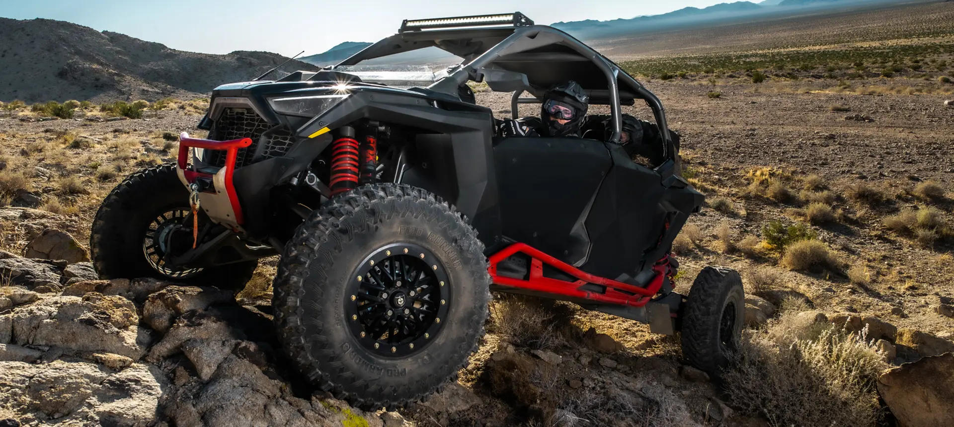 rzr pro r 4 side by side climbing over rocky terrain
