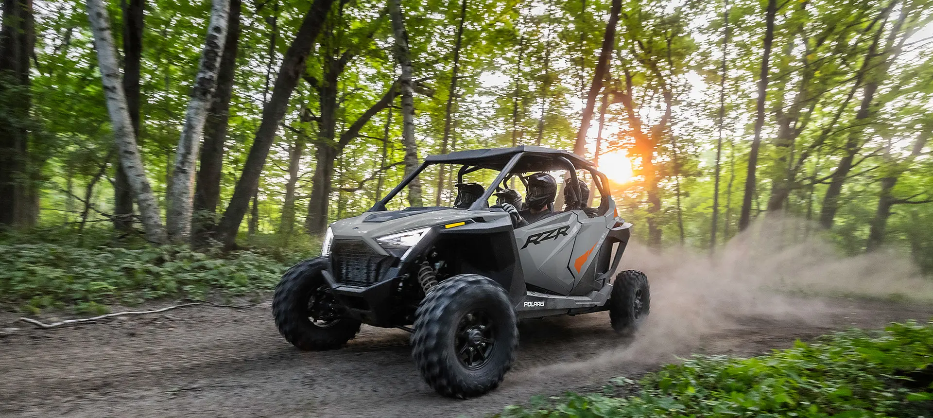 rzr pro xp 4 side by side cruising down a forest trail