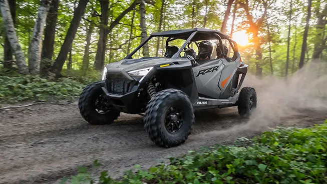 rzr pro xp 4 side by side cruising down a forest trail