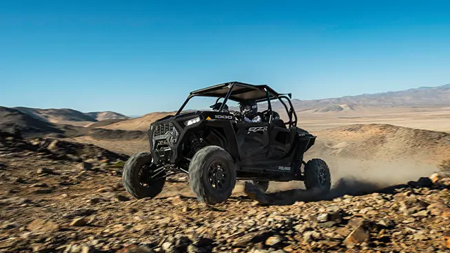 rzr xp 4 1000 driving over rocky terrain with ease