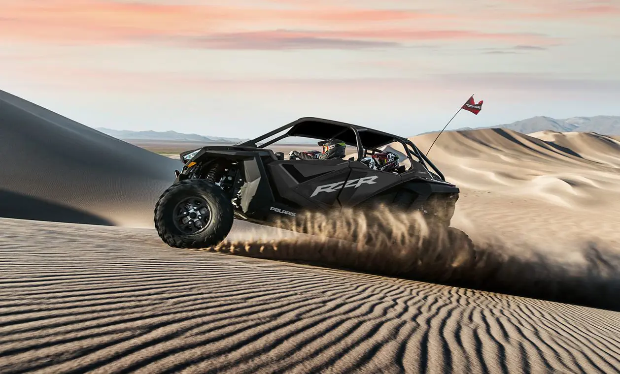 side profile of a polaris rzr pro xp 4 side by side in the dunes