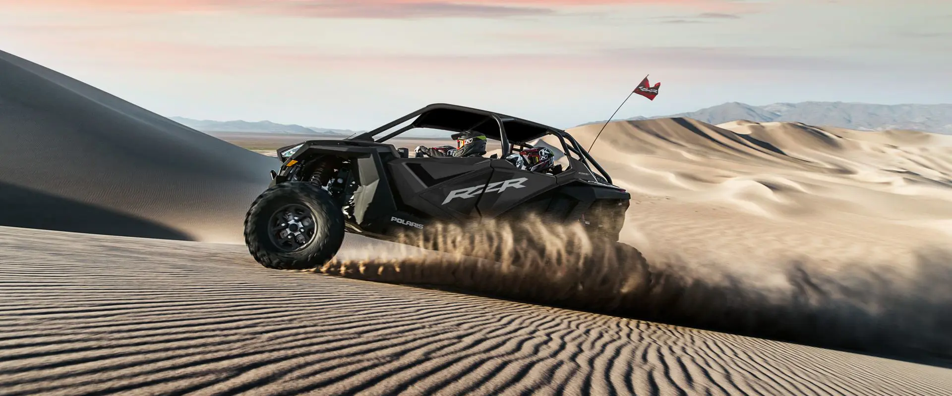 side profile of a polaris rzr pro xp 4 side by side in the dunes