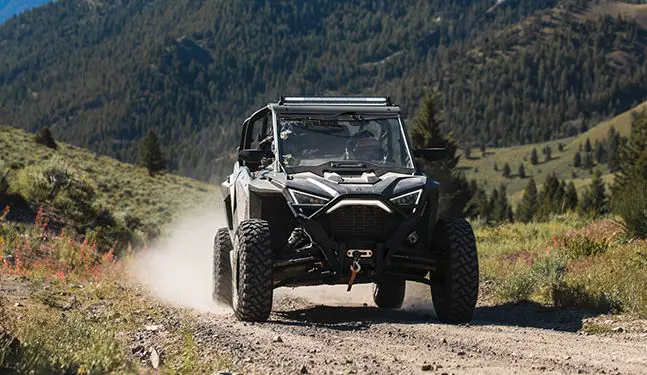 polaris rzr pro xp 4 side by side coming down a trail