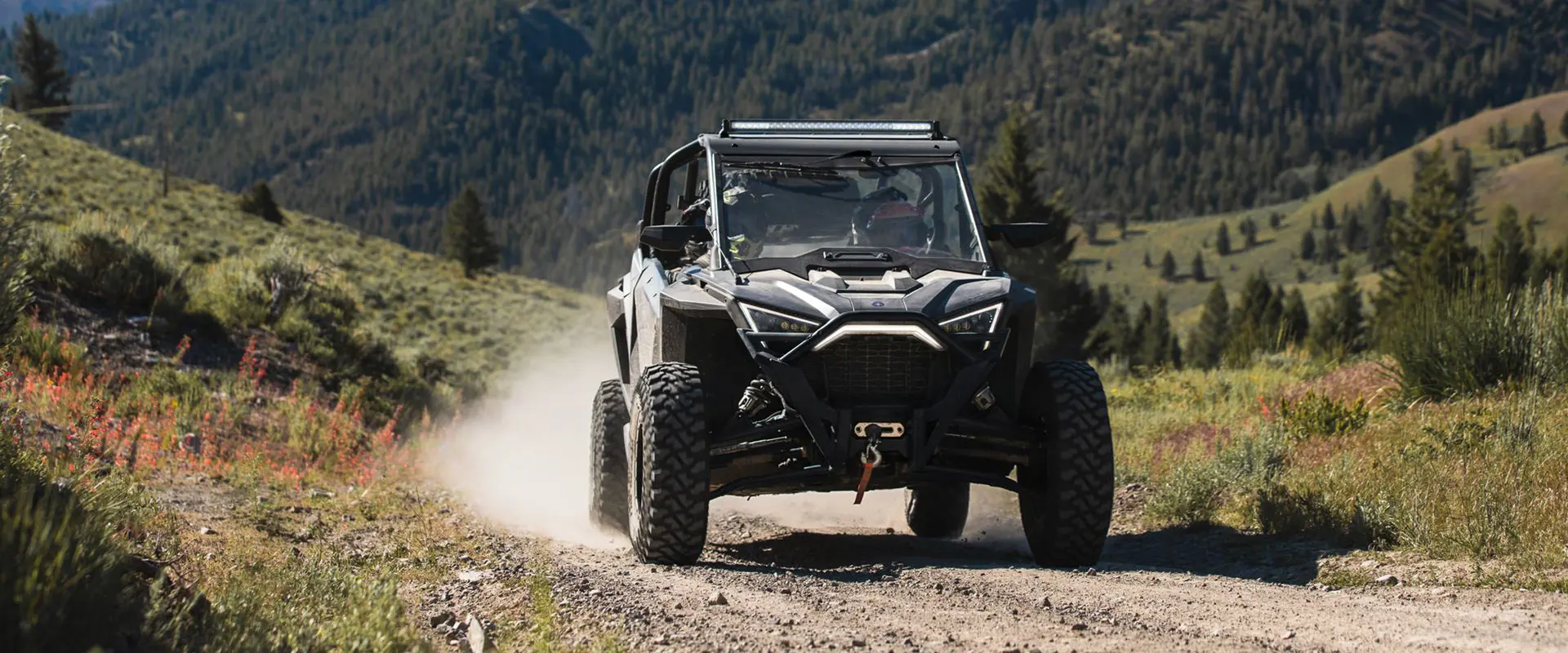 polaris rzr pro xp 4 side by side coming down a trail