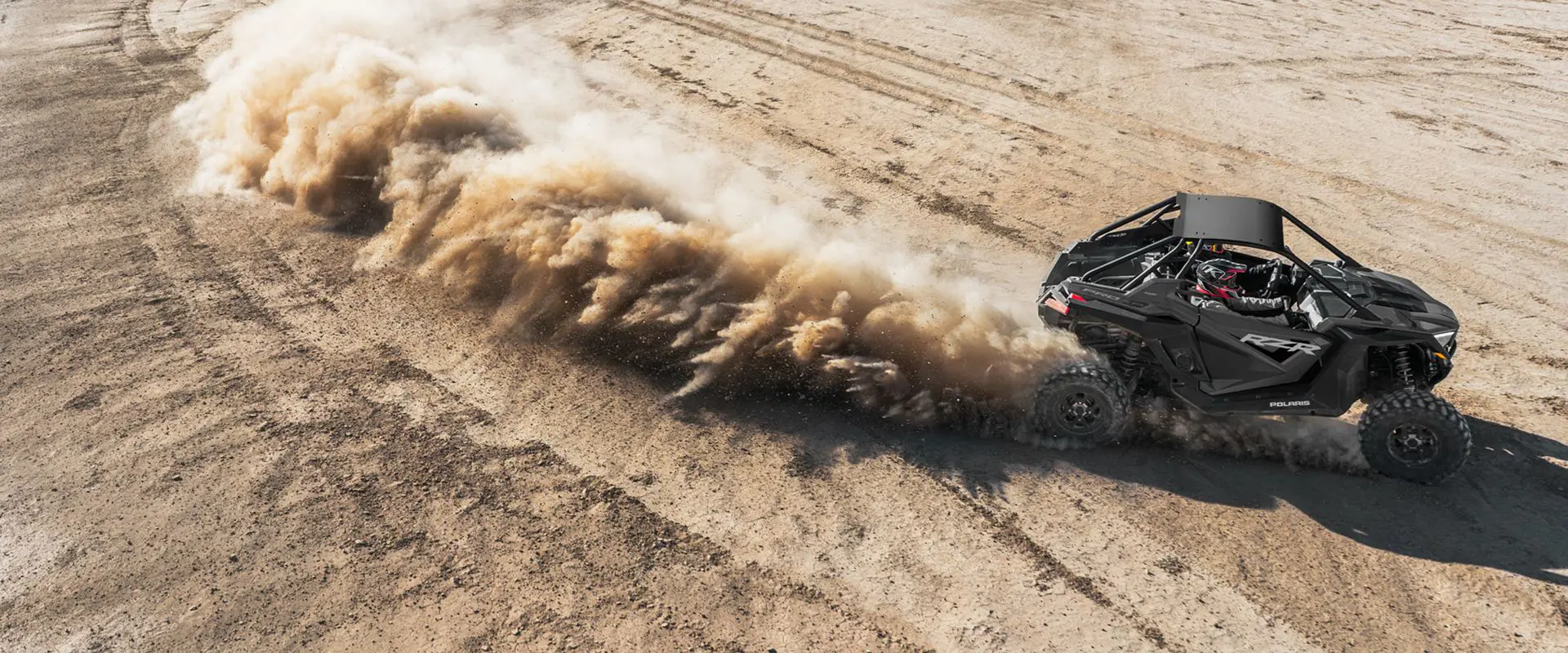 aerial view of a polaris rzr pro xp side by side in the desert