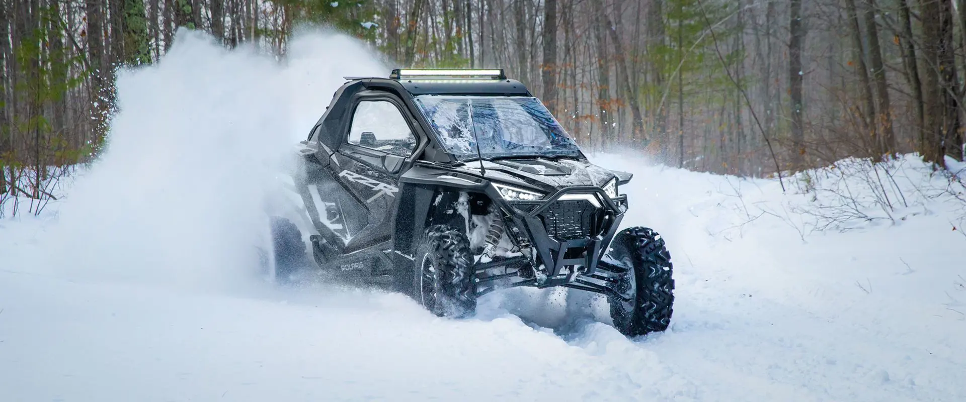 polaris rzr pro xp side by side cruising through the snow