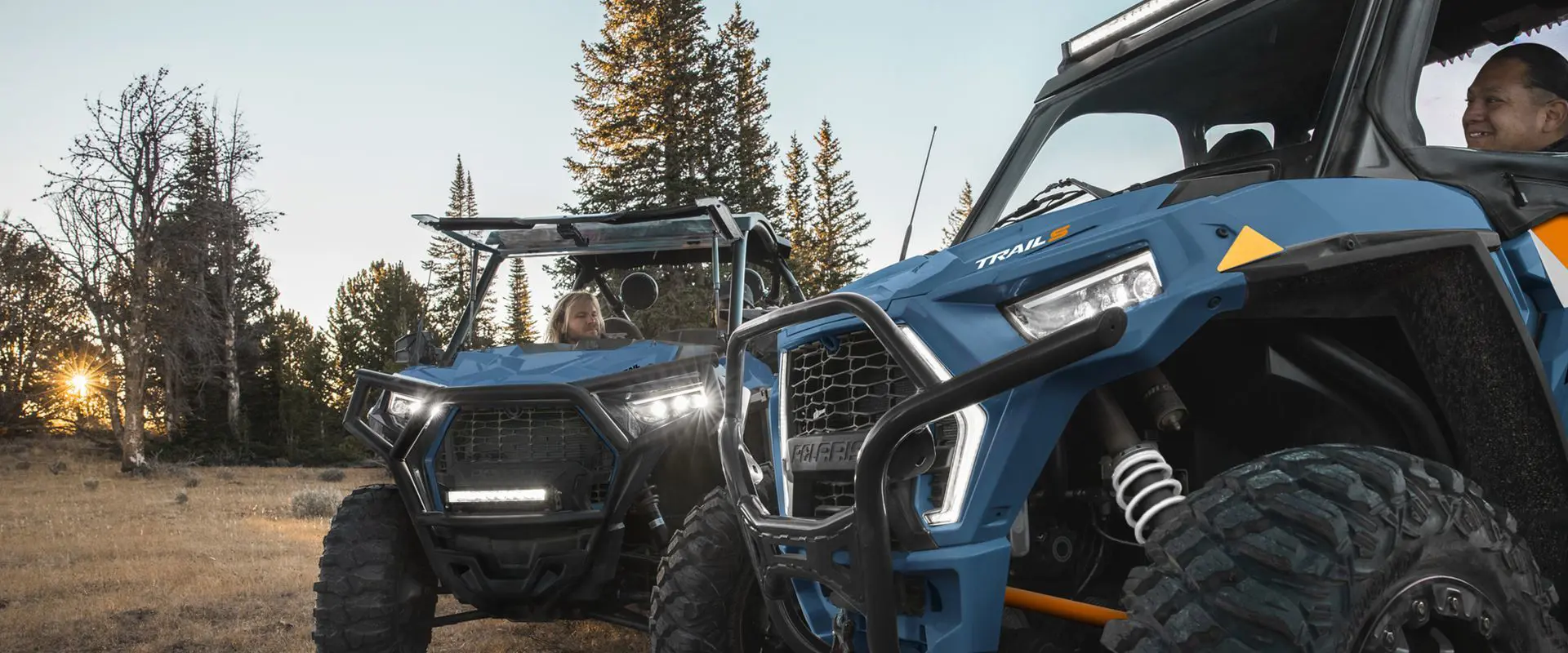 front ends of 2 polaris rzr trail s side by side