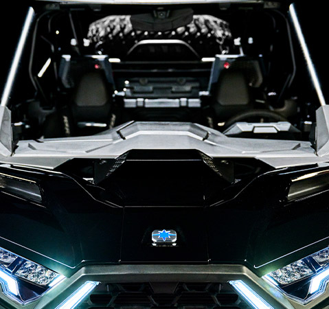 Close-up of the front end of a 2025 Polaris RZR Pro S side-by-side showcasing the new dual hood scoops that ram fresh air into the cab.