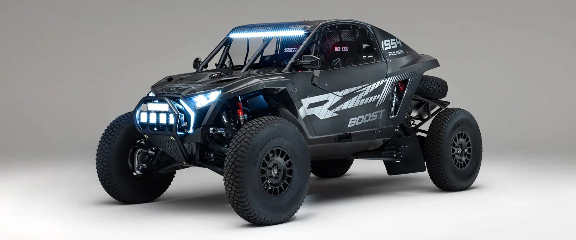 2027 Polaris RZR Pro R Factory Boost SxS with illuminated LED headlights, light bar and auxiliary lights.