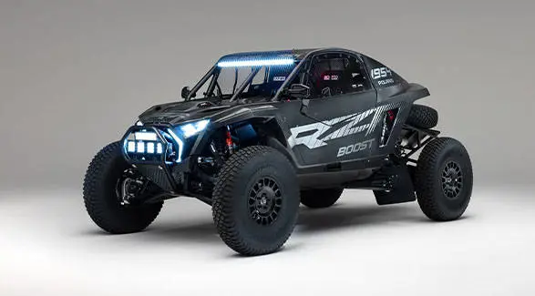 2027 Polaris RZR Pro R Factory Boost SxS with illuminated LED headlights, light bar and auxiliary lights.