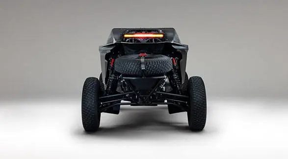 Rear view of a 2027 Polaris RZR Pro R Factory Boost SxS featuring a spare tire, suspension and illuminated rear light bar.