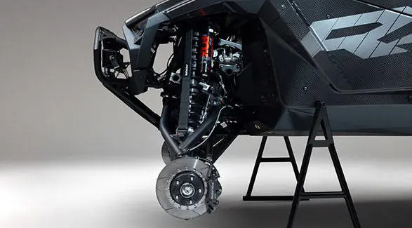 Close-up of the front suspension and brake assembly on a 2027 Polaris RZR Pro R Factory Boost side-by-side.