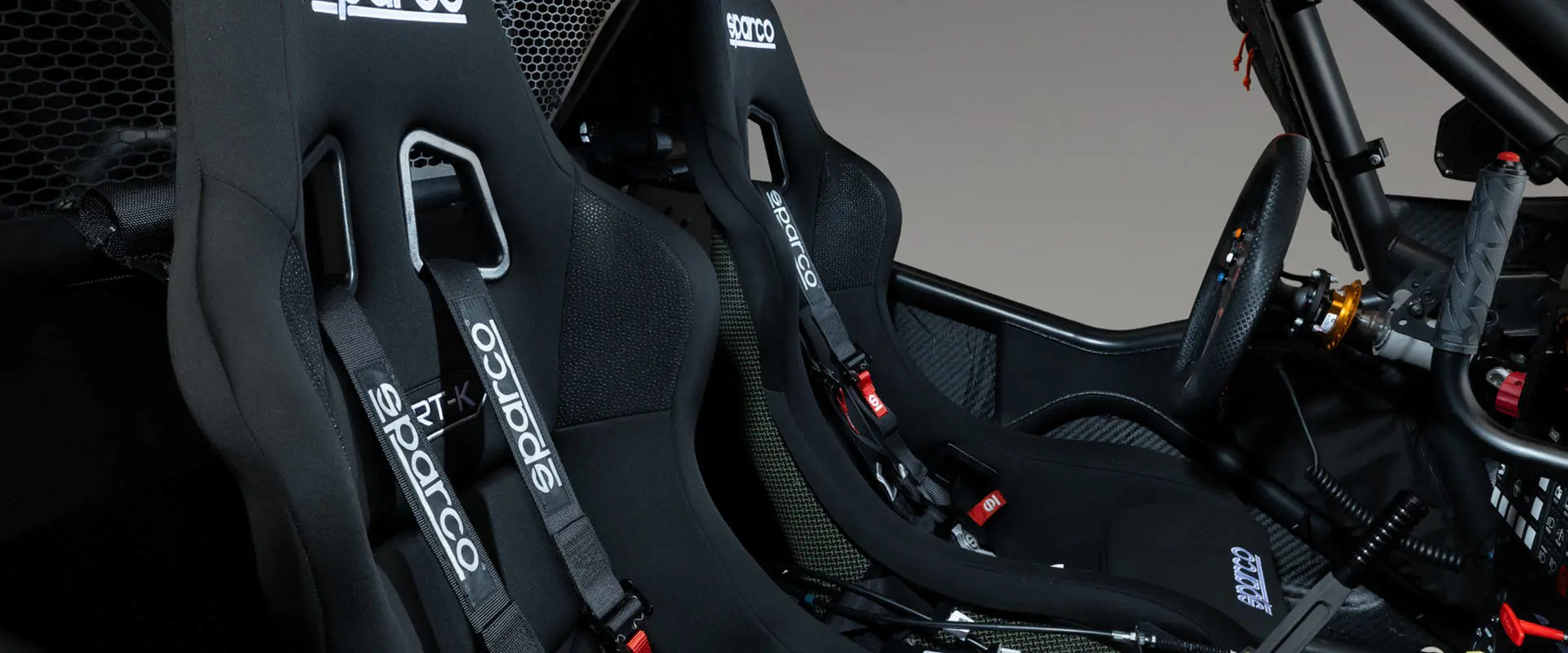 Close-up of Sparco racing seats and harnesses inside a 2027 Polaris RZR Pro R Factory Boost SxS.