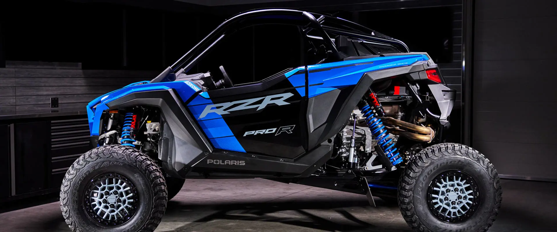 Clean side profile of the Polaris RZR Pro R Ultra Edition Velocity Blue against a dark background.
