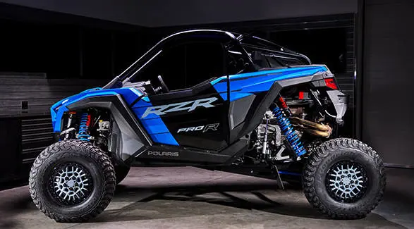 Clean side profile of the Polaris RZR Pro R Ultra Edition Velocity Blue against a dark background.