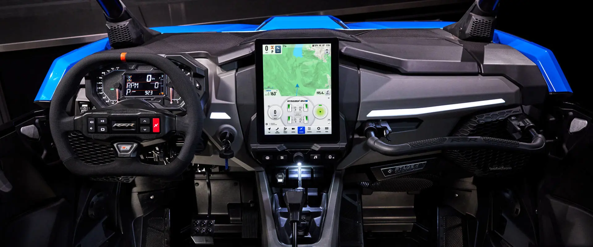 Full dashboard view of the RZR Pro R Ultra Edition Velocity Blue SxS, featuring a large, vertical touchscreen display.